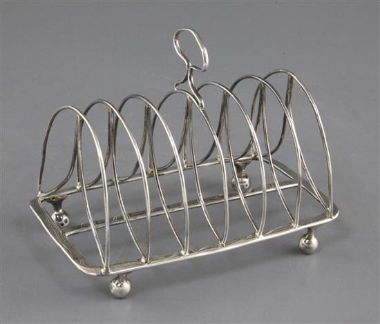 A George III silver seven bar toast rack by Thomas Lamborn, 7.5 oz.